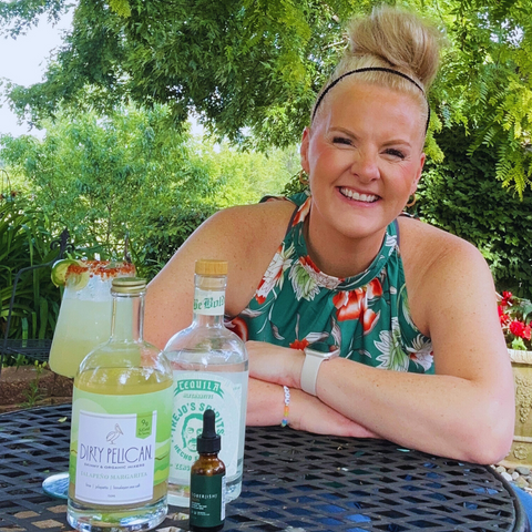 Image of Kim Gamez smiling in front of margarita making