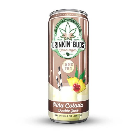 A can of Drinkin' Buds Piña Colada Double Shot featuring 10mg THC and CBD, with tropical fruit and cannabis leaf graphics on the label.