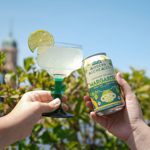 Modern Alchemist Margarita Cannabis Infused Mocktail in glass next to the can of the mocktail. Alcohol free.