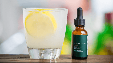 Image of mocktail drink with lemon and Sober(ish) THC Drops