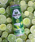 A can of Drinkin' Buds Margarita Double Shot with 10mg THC and CBD lies on a vibrant bed of sliced limes.