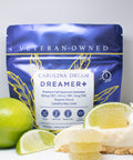 Carolina Dream Dreamer+ CBD gummies packaging with a slice of key lime pie and a lime on a white background.