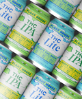 Multiple cans of Float House THC beverages arranged in a pattern.