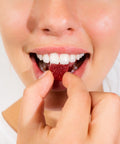A lady holding an Ease Full Spectrum CBD Gummy