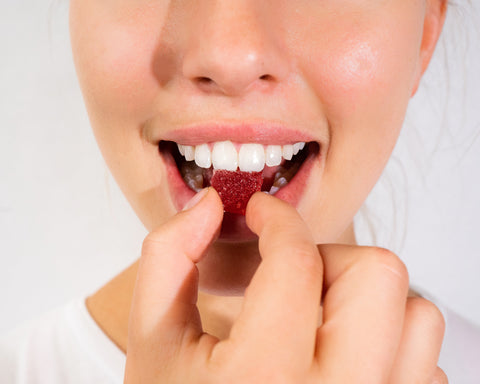 A lady holding an Ease Full Spectrum CBD Gummy