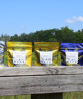 Five packages of Blendit CBD products on a wooden surface with a natural background