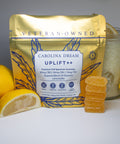 Gold package labeled 'Carolina Dream Uplift++' with lemons and a jar on a gray background