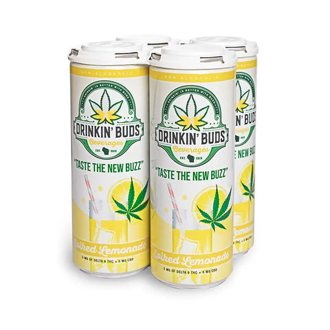 The image shows a four-pack of "Drinkin' Buds Beverages" in Spiked Lemonade flavor. The cans feature a white and yellow design with a cannabis leaf logo, the slogan "Taste the New Buzz," and illustrations of a lemonade glass with a straw, highlighting the drink's citrusy and refreshing qualities infused with 5 mg of Delta 9 THC and 5 mg of CBD.