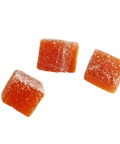 Three orange Happly gummy cubes